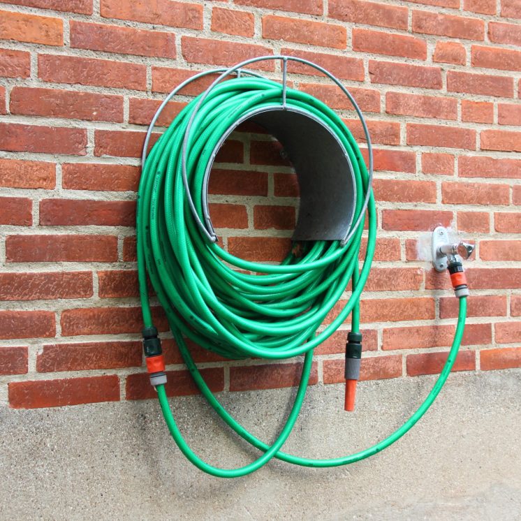 Green,Water,Hose,Hanging,Red,Brick,Wall